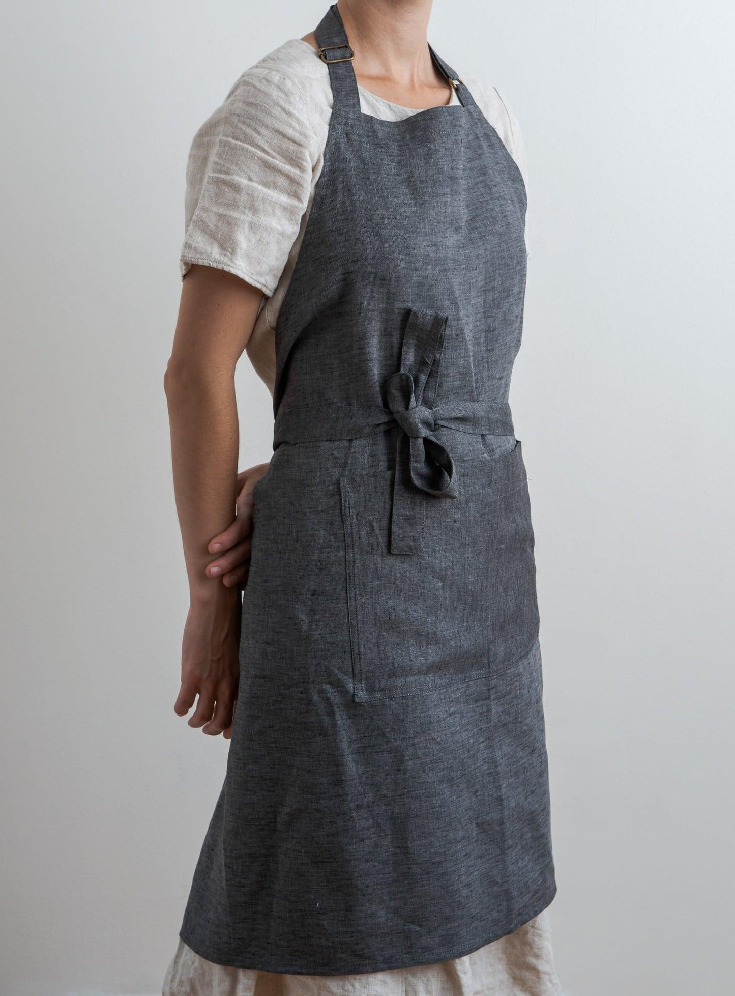 woman wearing a linen charcoal apron