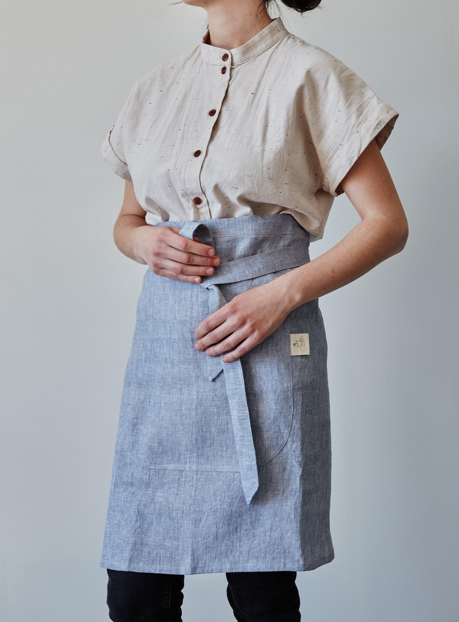Front of our lavender linen half apron with large pocket