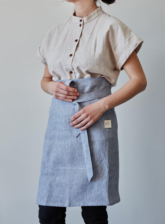 Front of our lavender linen half apron with large pocket