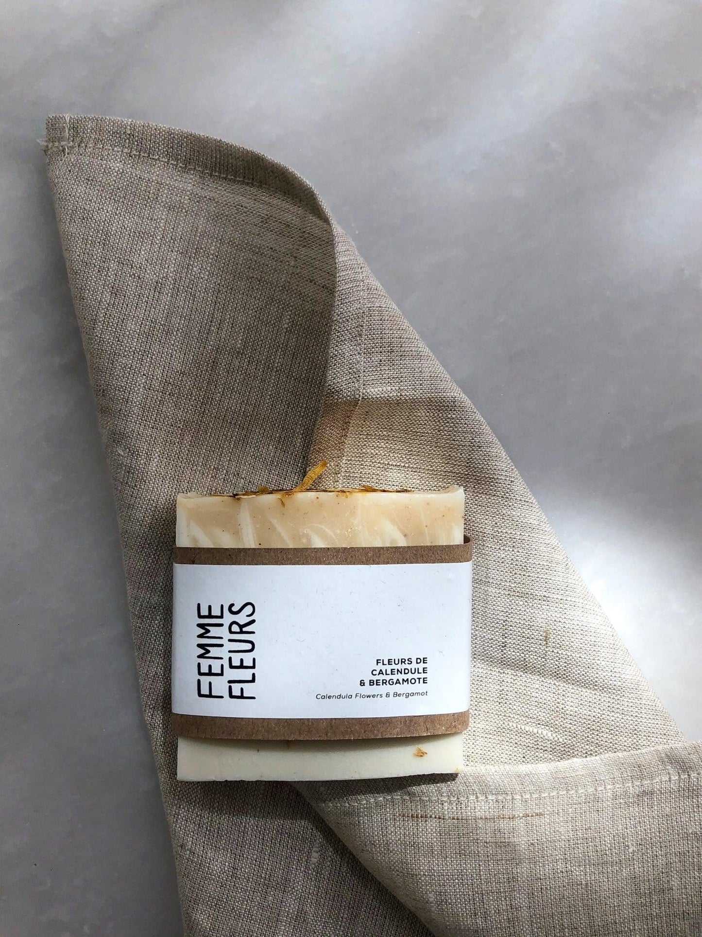 Calendula flower & bergamot soap on confetti mill tea towel