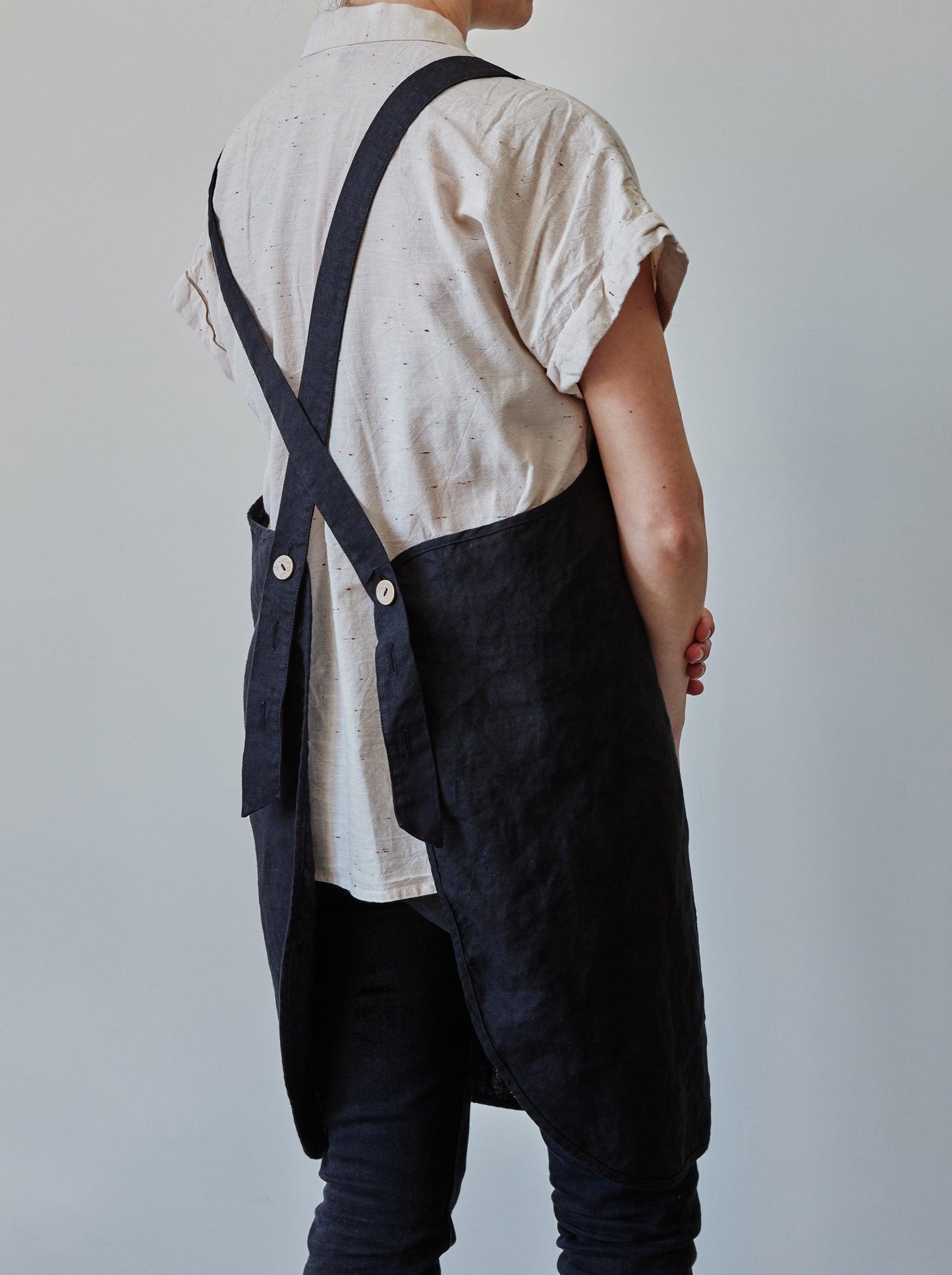 Back of our black linen apron with coconut buttons