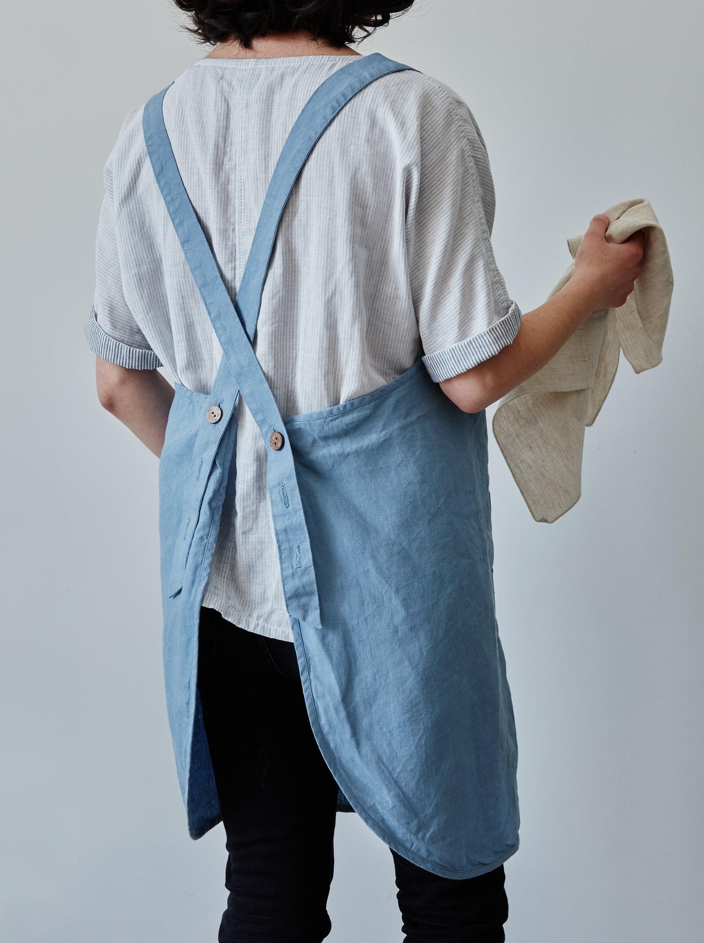 Back of our blue linen apron with coconut buttons
