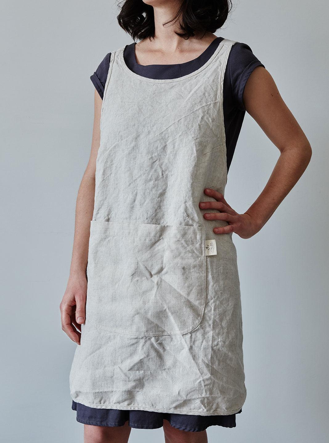 Front of our oat linen apron with a view of the pocket
