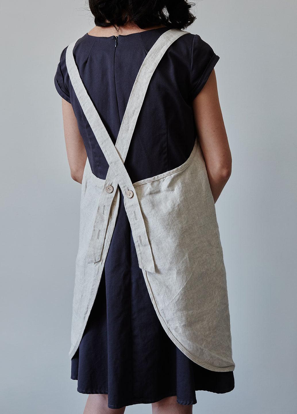 Back of our oat linen apron with coconut buttons