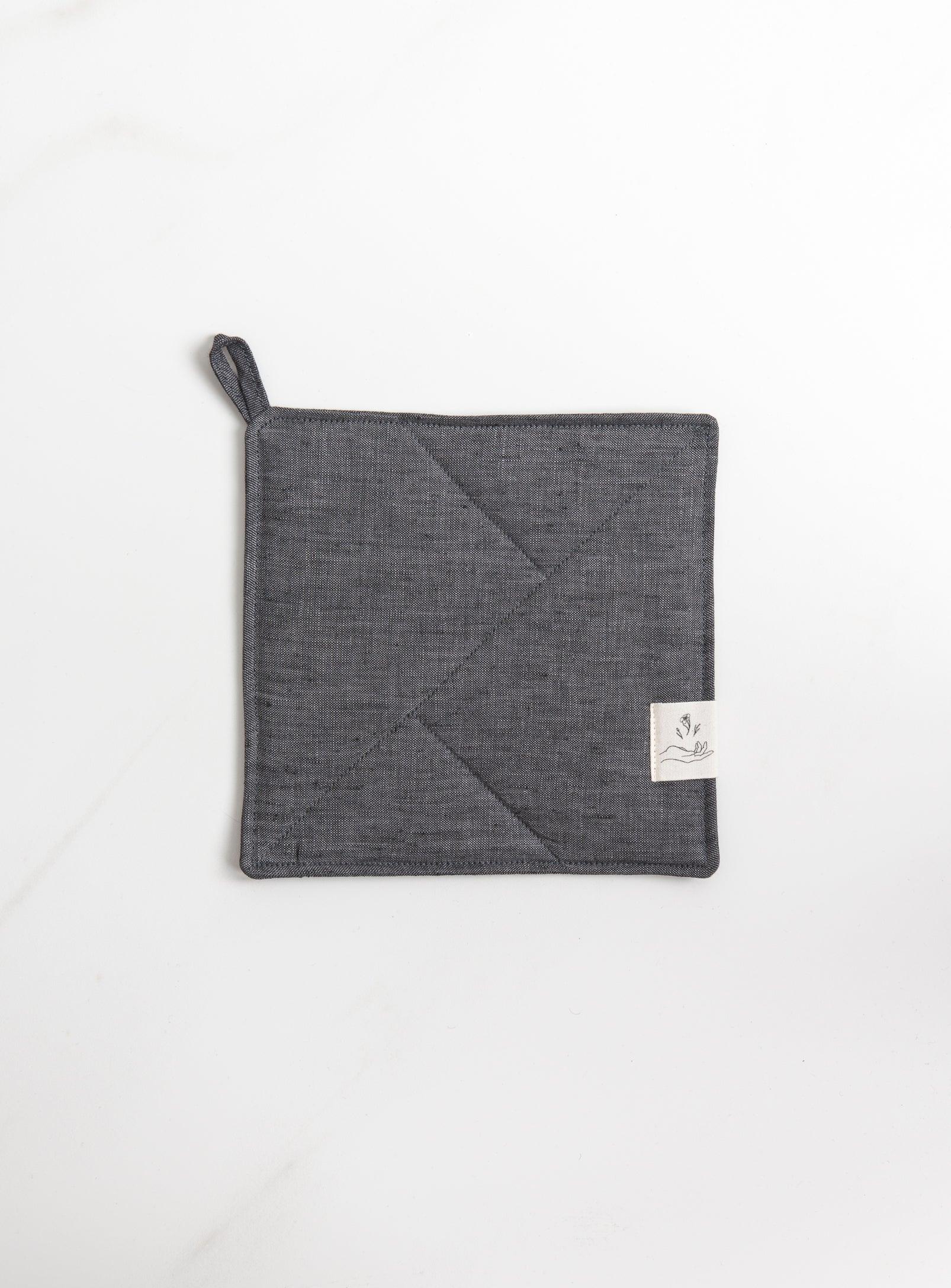 grey pot holder on a white surface